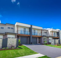 Escape At Nobbys Executive Townhouse 1 74 Pacific Drive - Winery Find